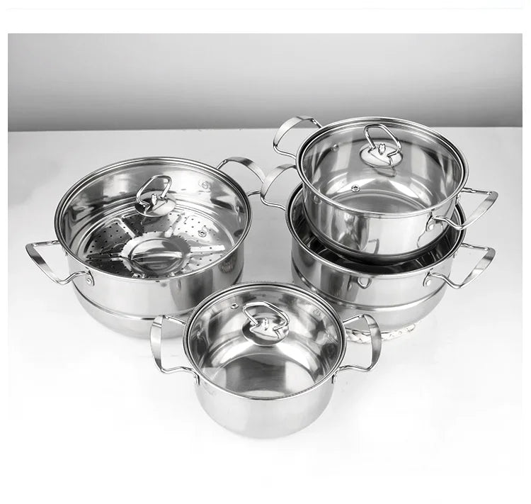 Stel durable stainless steel cookware set with lids on white surface, plastic-free kitchenware